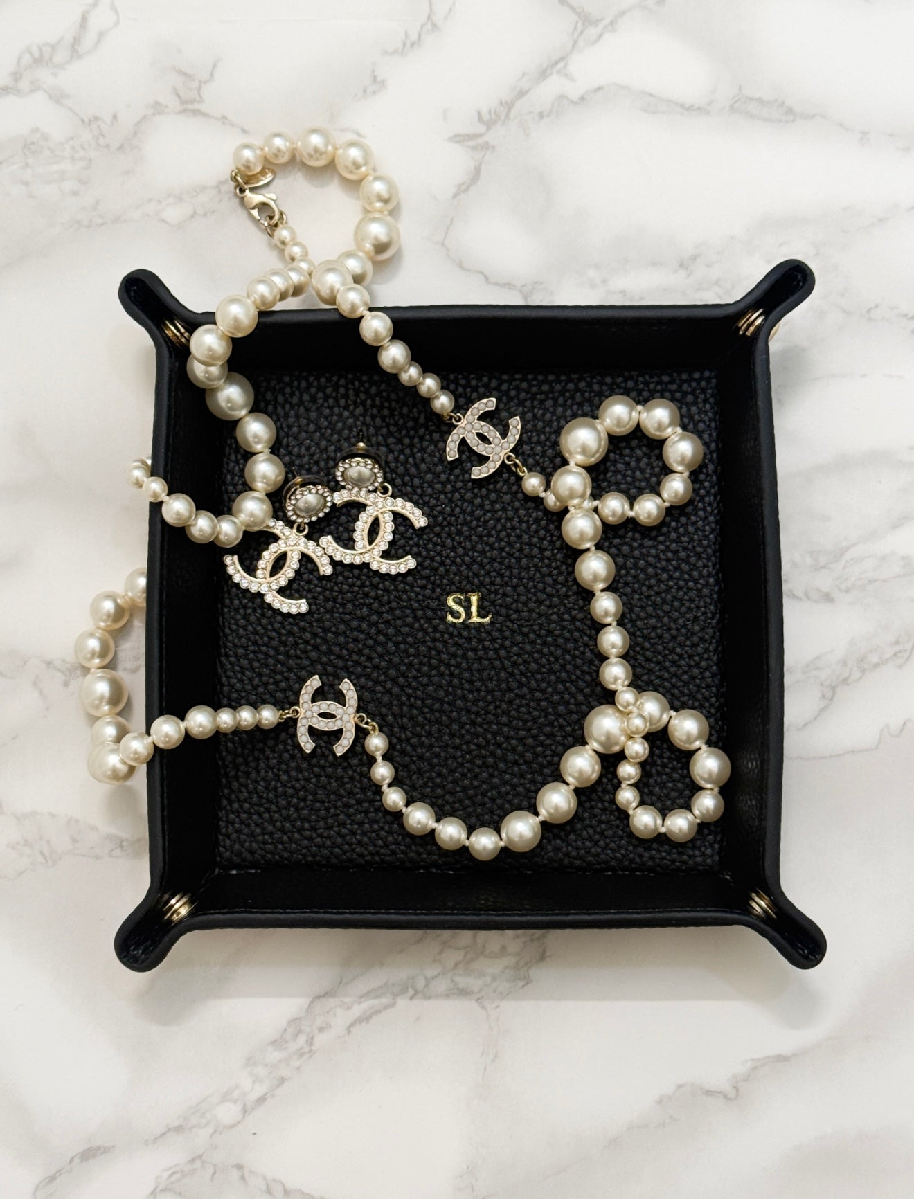 black monogrammed catchall tray with pearls inside