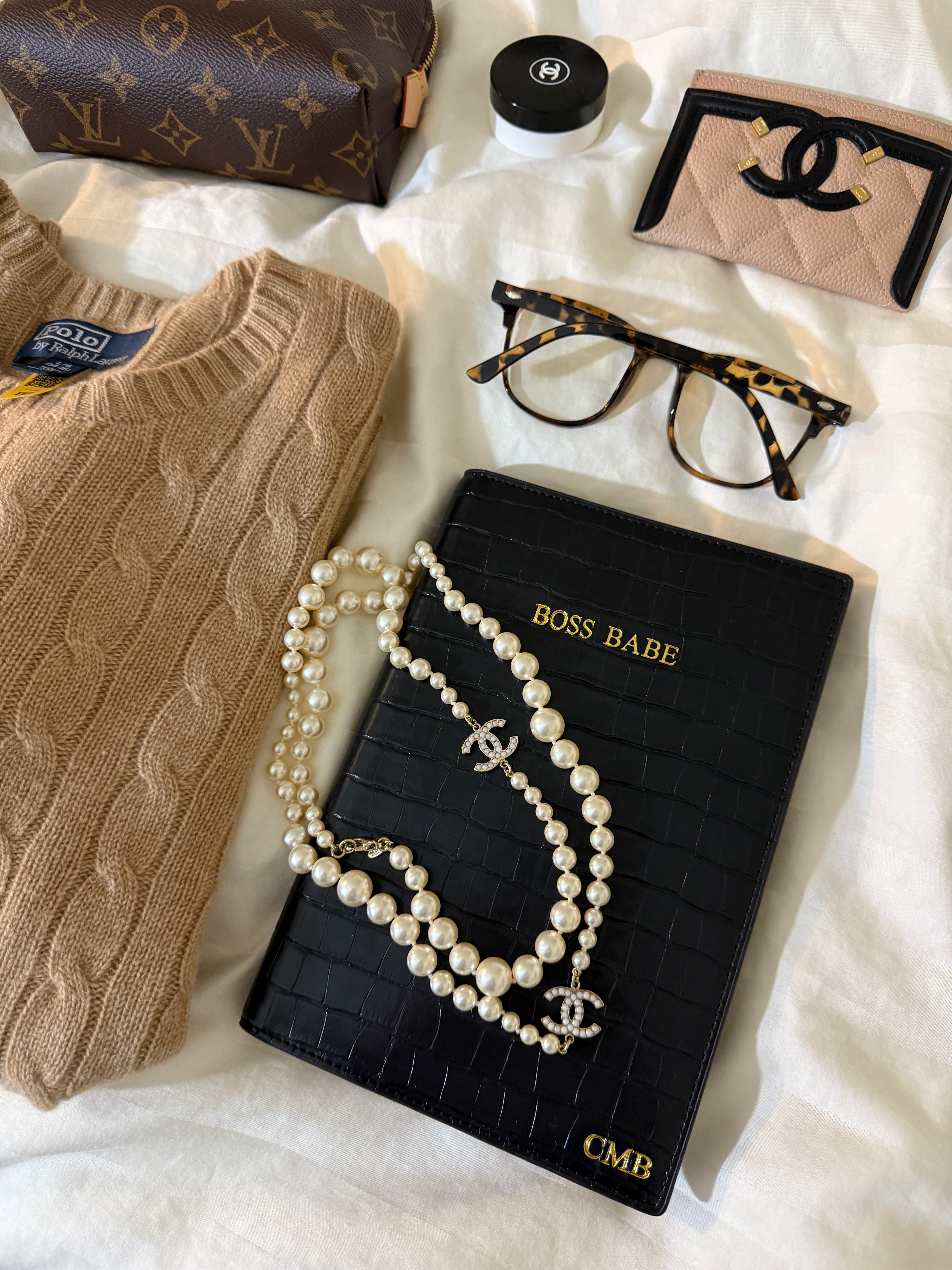 monogrammed boss bade notebook with pearls, glasses, and makeup