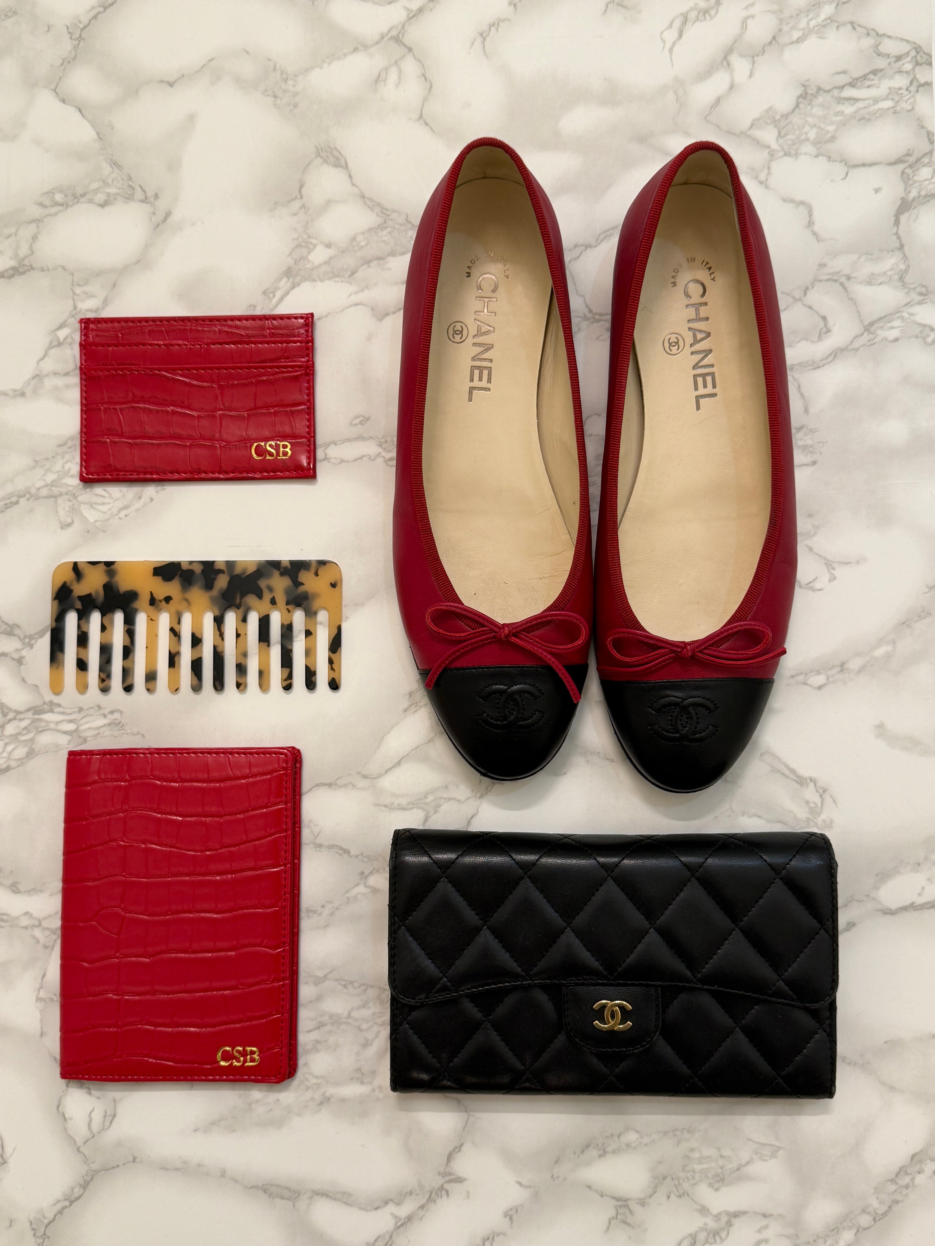 red monogrammed croc cardholder and passport cover with comb, wallet, and flats