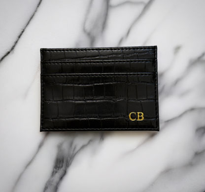 black monogram croc cardholder on marble background