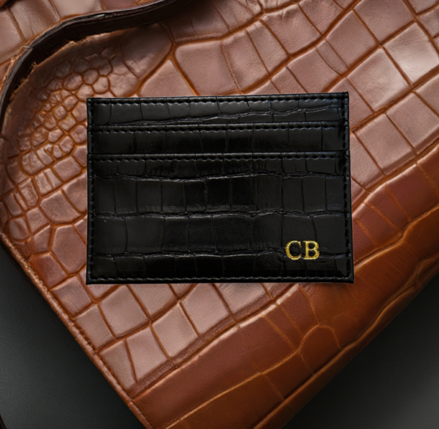 black monogrammed croc cardholder on brown croc handbag